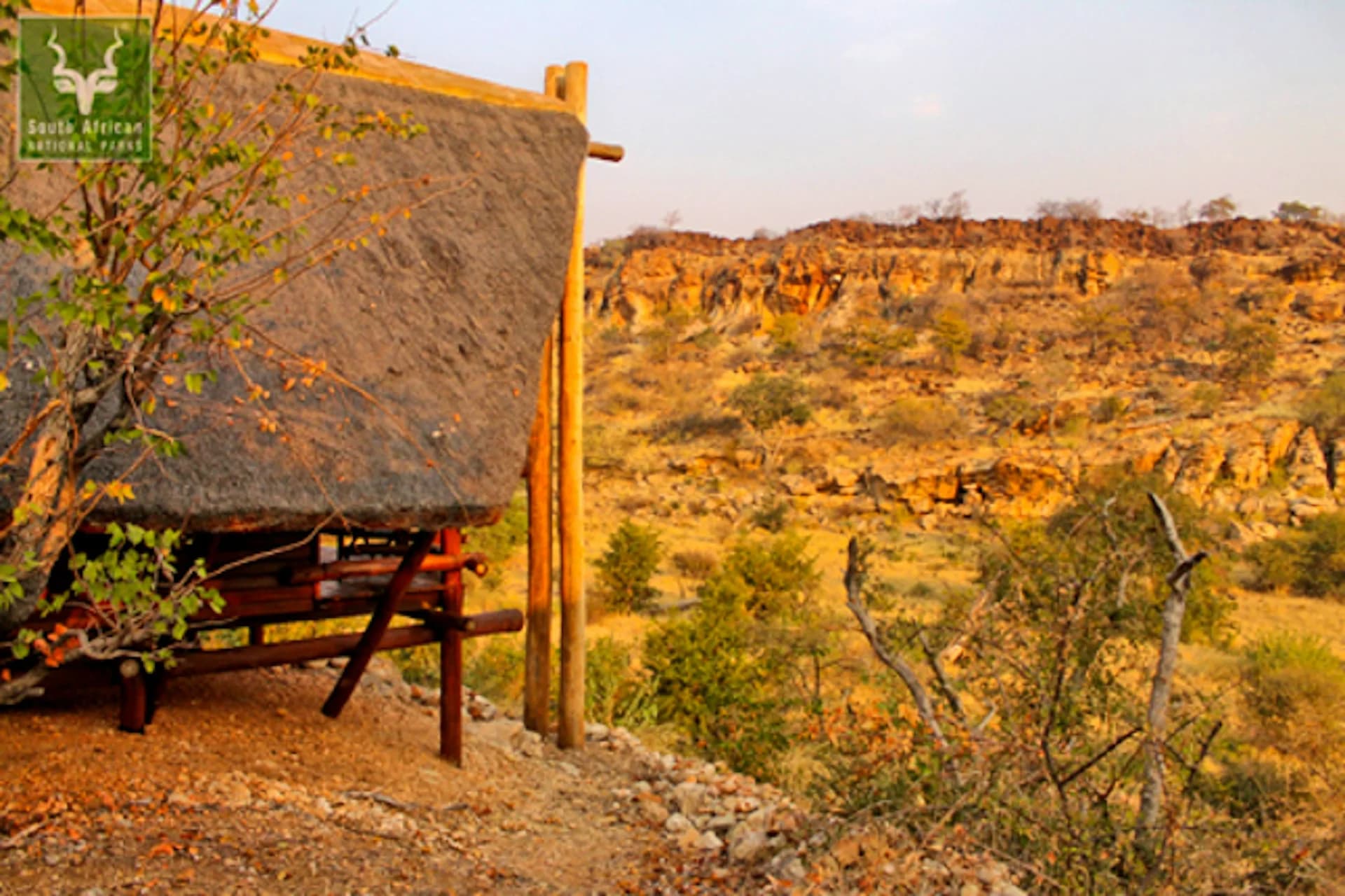 Elevated timber and canvas cabin overlooking dry bushveld, Vhembe Wilderness Camp