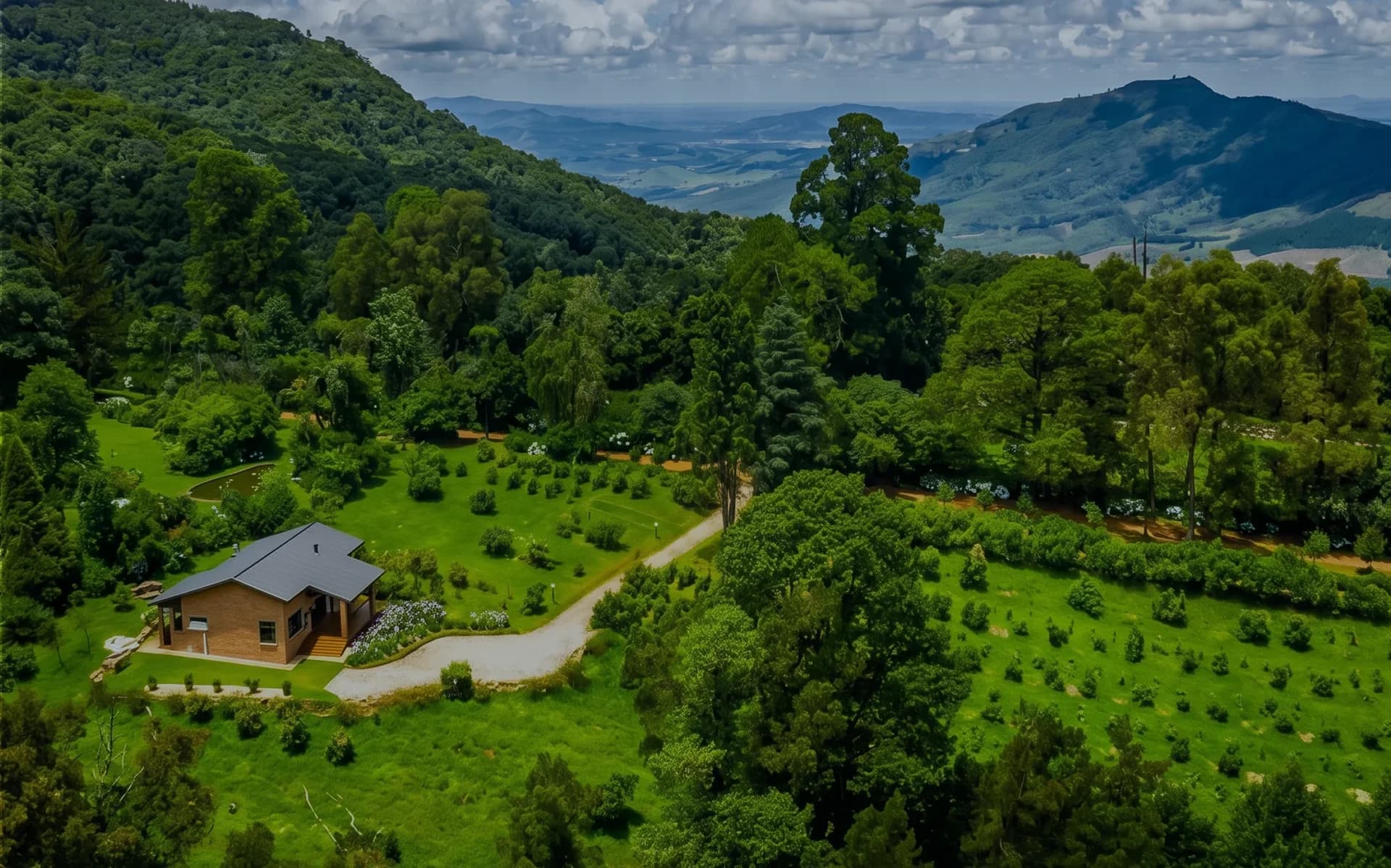 Aerial view of a cottage, orchard and wooded mountain landscape, Kuhestan farm stays