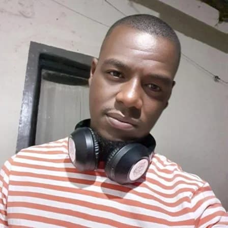 Portrait of a man in a striped shirt wearing headphones around his neck, Gift Makhari Ribola lifestyle tour